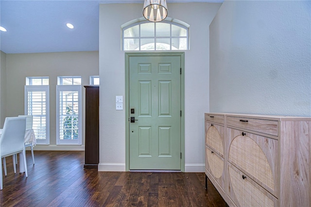 foyer entrance with dark wood-style floors, baseboards, and recessed lighting