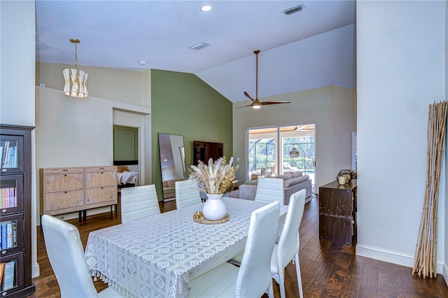 dining area featuring visible vents, a ceiling fan, wood finished floors, high vaulted ceiling, and baseboards