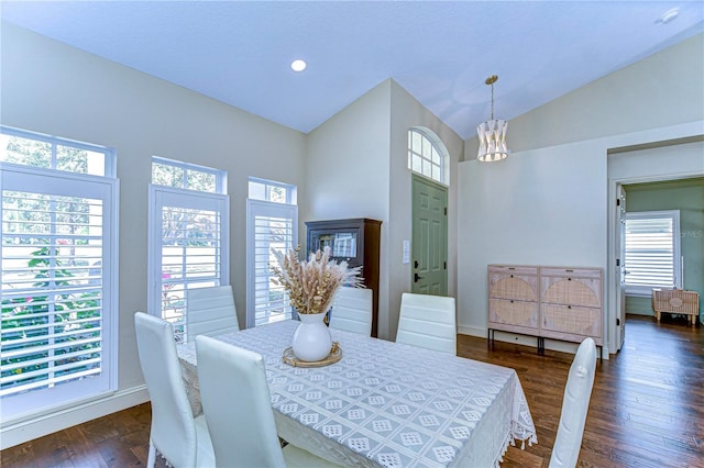 dining room featuring vaulted ceiling, recessed lighting, dark wood finished floors, and an inviting chandelier