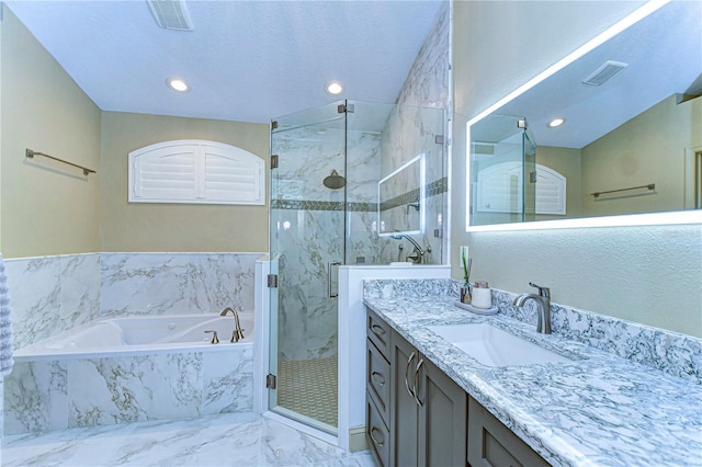 bathroom with visible vents, vanity, marble finish floor, a marble finish shower, and a bath