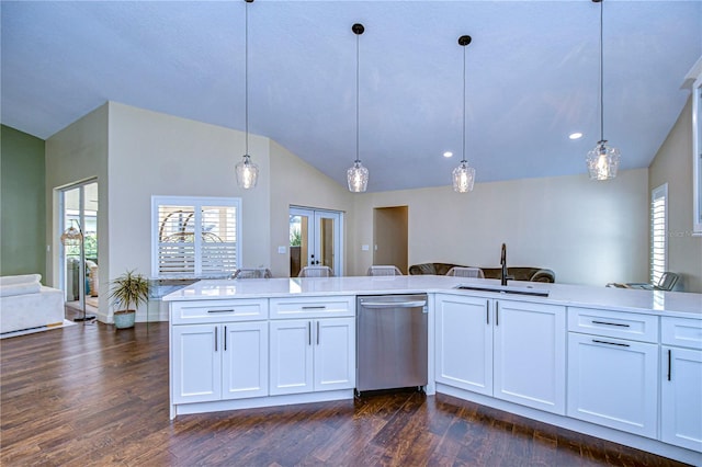 kitchen featuring lofted ceiling, dark wood-type flooring, french doors, stainless steel dishwasher, and a sink