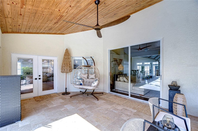 view of patio / terrace with a ceiling fan and french doors