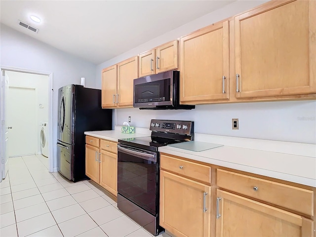 5351 Lookout Pass, Wesley Chapel, FL 33544 - kitchen featuring light brown cabinetry, stainless steel appliances, visible vents, washer / clothes dryer, and light tile patterned flooring