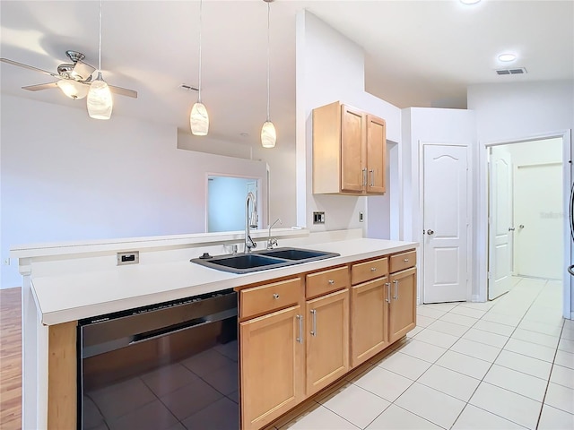 5351 Lookout Pass, Wesley Chapel, FL 33544 - kitchen with a sink, visible vents, light countertops, light brown cabinetry, and black dishwasher