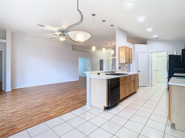 5351 Lookout Pass, Wesley Chapel, FL 33544 - kitchen featuring light countertops, dishwasher, a sink, a ceiling fan, and open floor plan