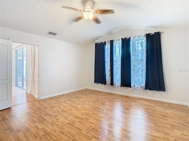 5351 Lookout Pass, Wesley Chapel, FL 33544 - unfurnished room with a wealth of natural light, visible vents, light wood-style flooring, and vaulted ceiling