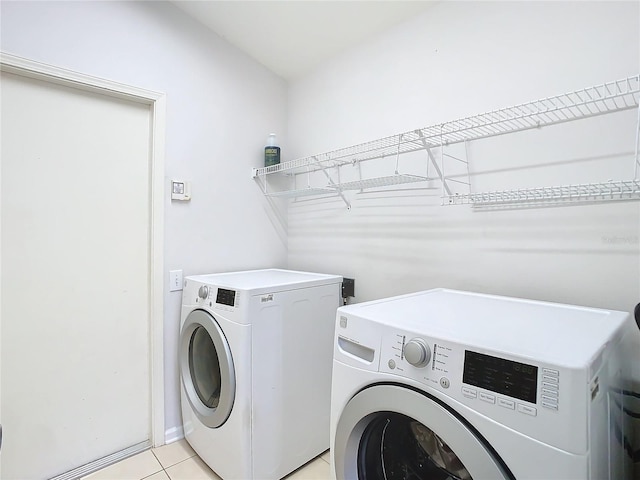 5351 Lookout Pass, Wesley Chapel, FL 33544 - laundry room featuring light tile patterned floors, laundry area, and washing machine and dryer