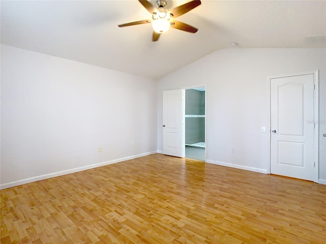5351 Lookout Pass, Wesley Chapel, FL 33544 - empty room featuring baseboards, ceiling fan, light wood finished floors, and vaulted ceiling
