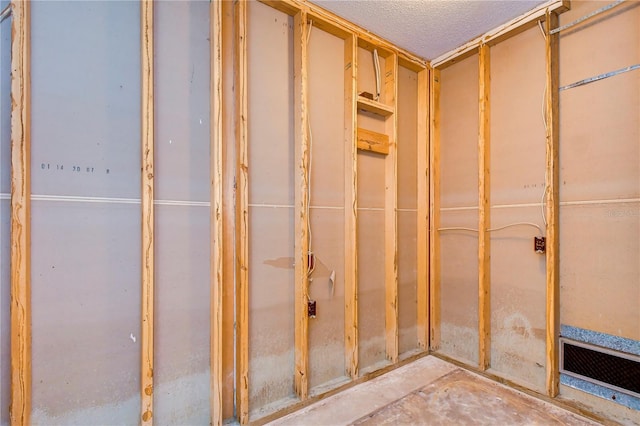 interior space featuring visible vents and a textured ceiling