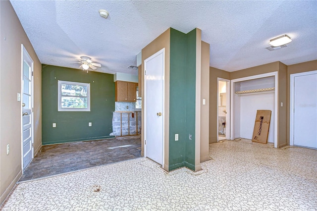 interior space featuring a textured ceiling