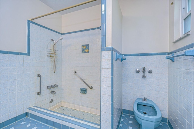 full bathroom featuring wainscoting, tiled shower, tile walls, and a bidet