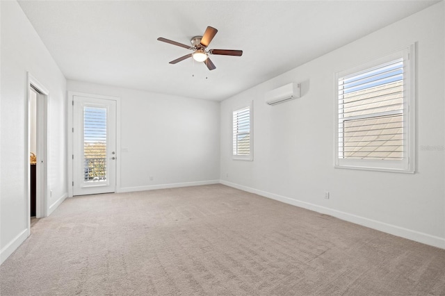 empty room with light carpet, plenty of natural light, and a wall mounted air conditioner