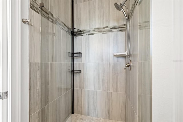 full bath featuring a tile shower