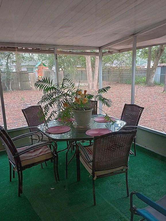 sunroom with wood ceiling