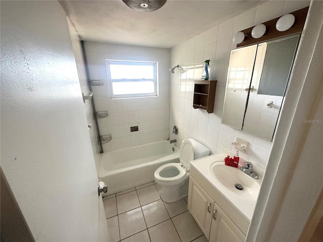 bathroom featuring toilet, tile patterned floors,  shower combination, vanity, and tile walls