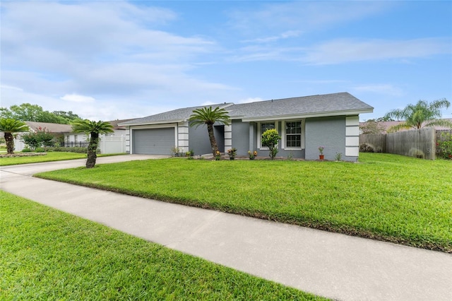 single story home featuring an attached garage, fence, concrete driveway, stucco siding, and a front yard