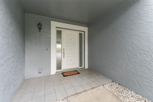 doorway to property with stucco siding