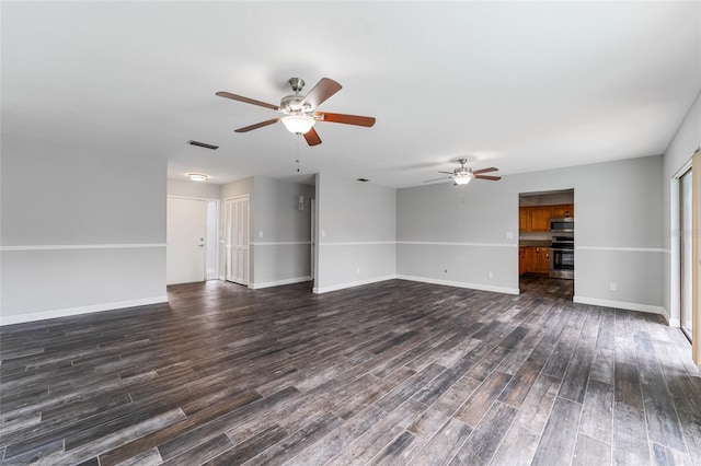 unfurnished living room featuring dark wood-style floors, visible vents, baseboards, and a ceiling fan