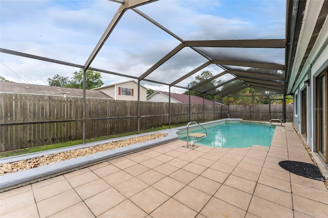 view of pool with a fenced in pool, glass enclosure, a fenced backyard, and a patio