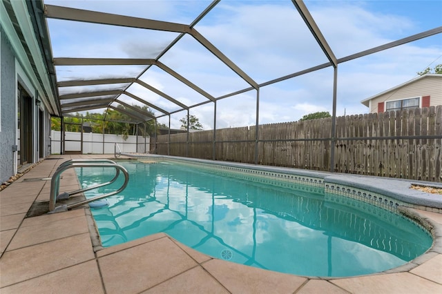 view of pool with a lanai, a fenced backyard, and a fenced in pool