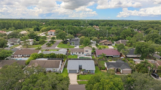 bird's eye view featuring a forest view and a residential view