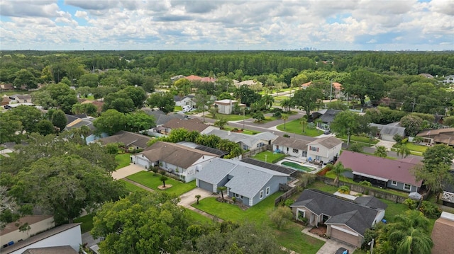 aerial view featuring a residential view and a view of trees