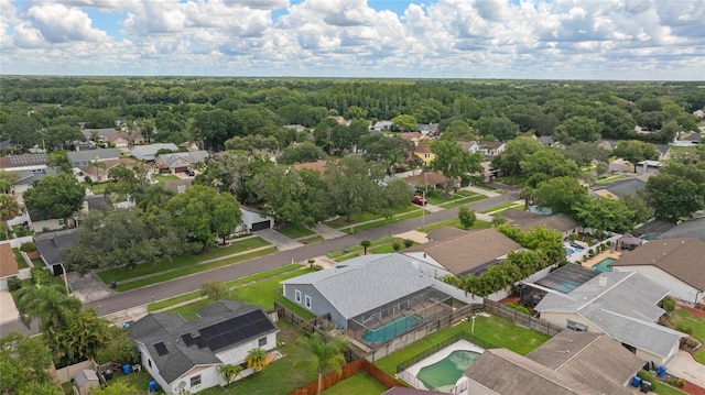 bird's eye view with a forest view and a residential view