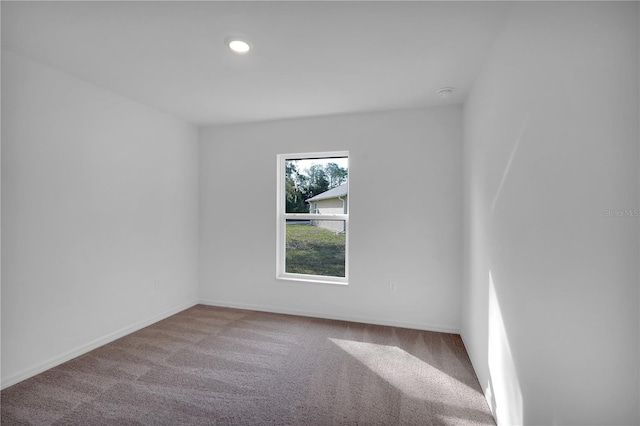 carpeted empty room with recessed lighting and baseboards