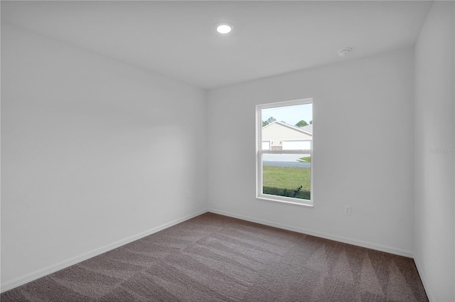 unfurnished room featuring carpet, baseboards, and recessed lighting