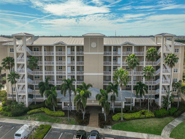 view of property featuring uncovered parking