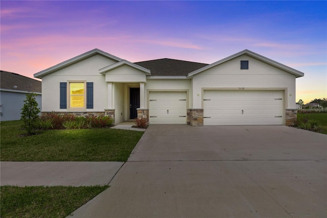 ranch-style house with a garage, stone siding, driveway, and stucco siding