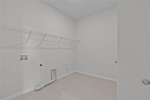 clothes washing area with laundry area, hookup for a washing machine, electric dryer hookup, and baseboards