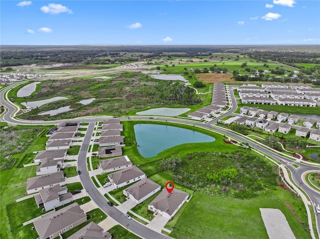 birds eye view of property featuring a residential view and a water view