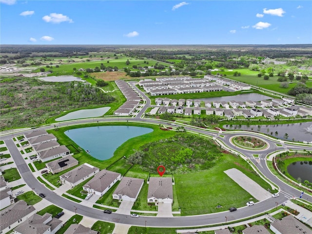 bird's eye view featuring a residential view and a water view