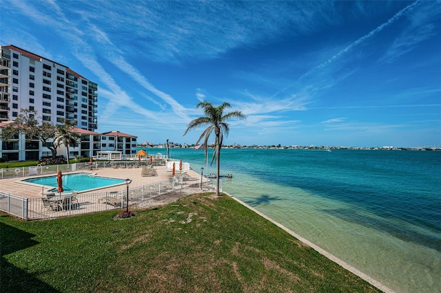 view of water feature with fence and a boat dock