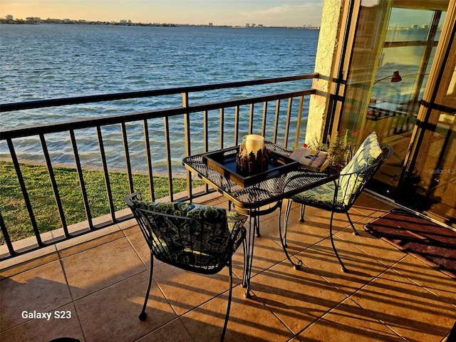 balcony featuring a water view