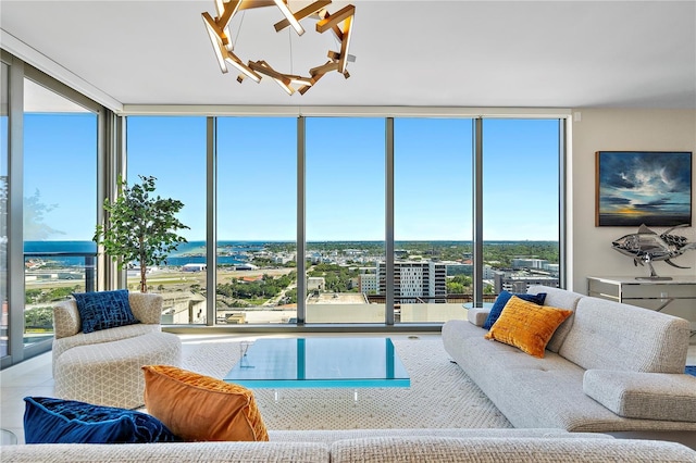 living room featuring expansive windows and a notable chandelier