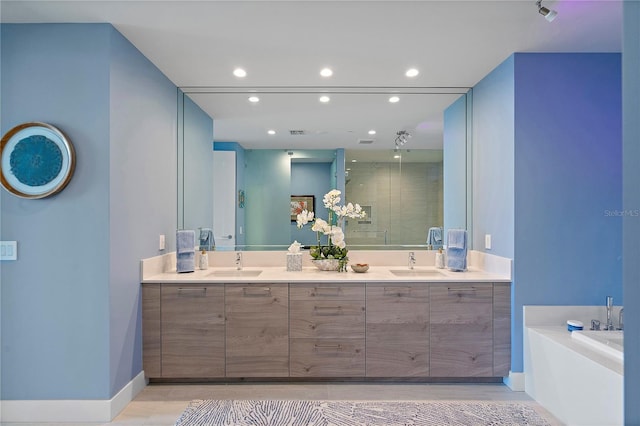 bathroom featuring double vanity, a sink, and recessed lighting