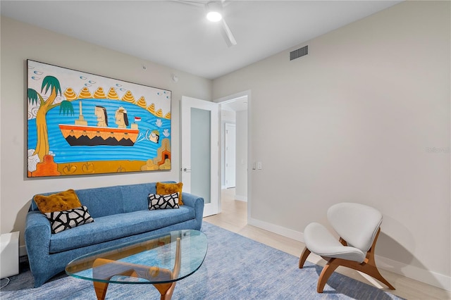 living room with visible vents and baseboards