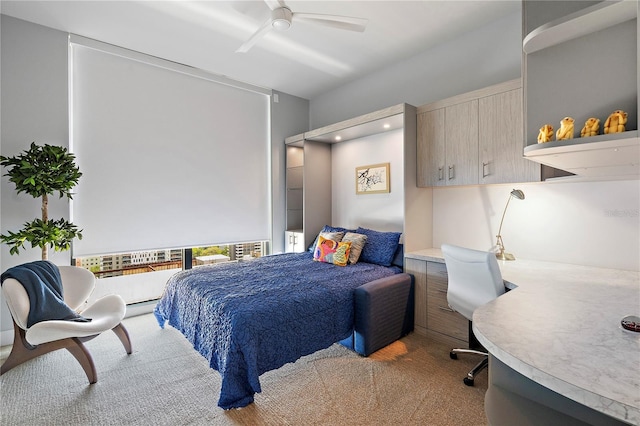 bedroom with carpet floors and a ceiling fan