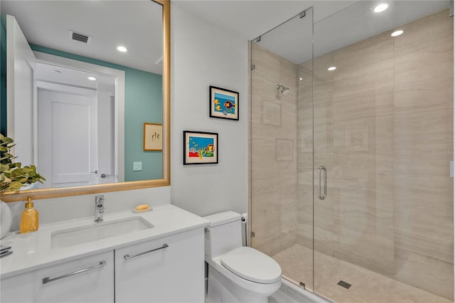 full bathroom featuring visible vents, toilet, vanity, a shower stall, and recessed lighting