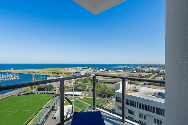 balcony featuring a water view