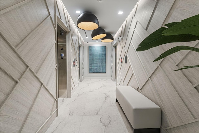 hallway with marble finish floor