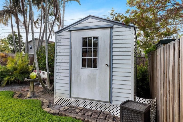 view of shed featuring a fenced backyard