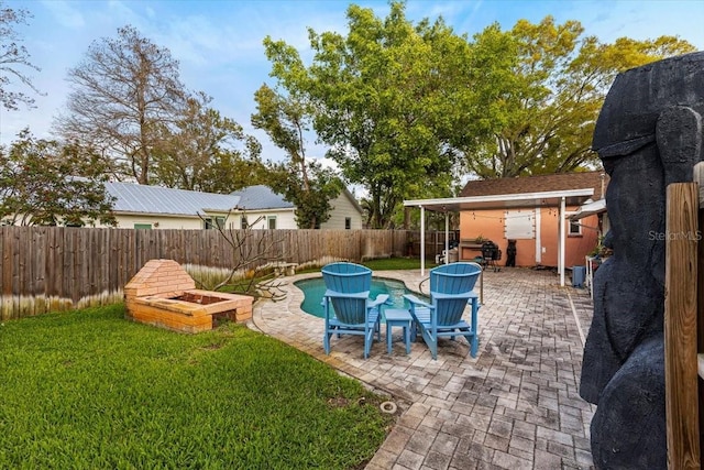 view of pool with a patio, a yard, a fenced backyard, and a fenced in pool