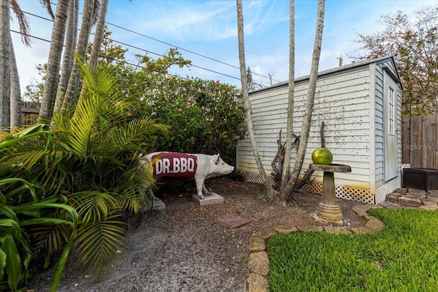 exterior space with fence and an outdoor structure