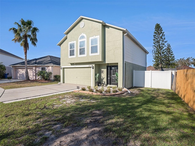 view of front of property with driveway, a front lawn, fence, and stucco siding