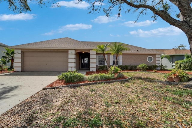 ranch-style home with a garage, concrete driveway, and stucco siding