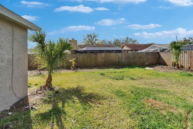 view of yard with a fenced backyard