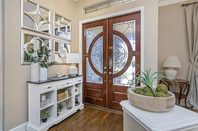 entrance foyer with dark wood-style floors and french doors